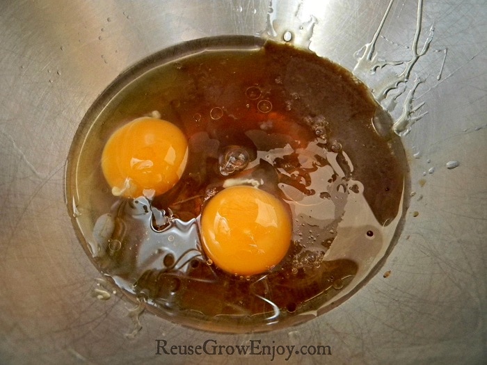 Wet ingredients including eggs in stand mixer bowl