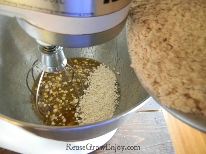 Dry ingredients slowly being added to wet in mixing bowl