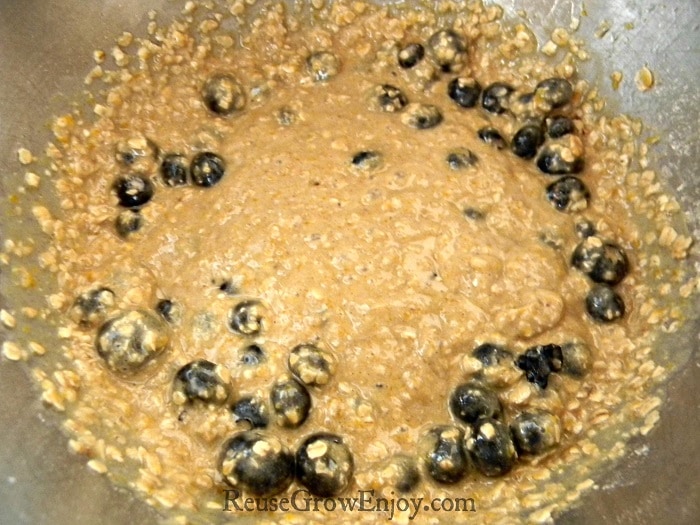 Blueberries being mixed into batter