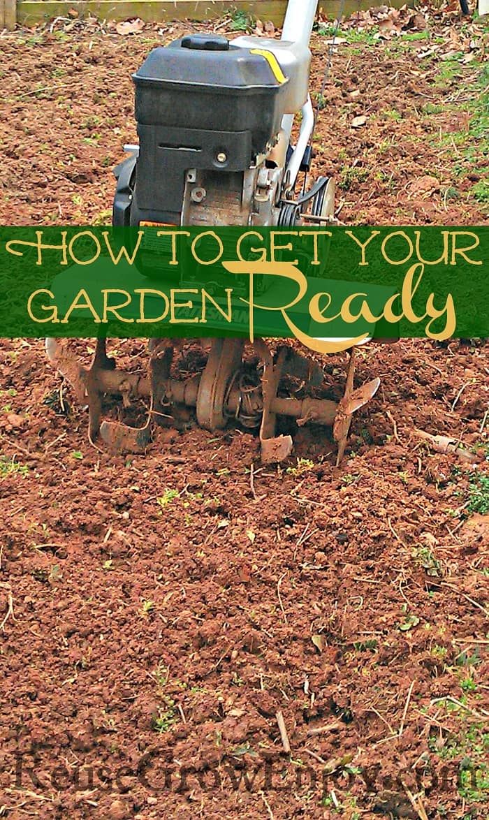 A tiller sitting in a freshly tilled up garden area with a text overlay in the middle that says 