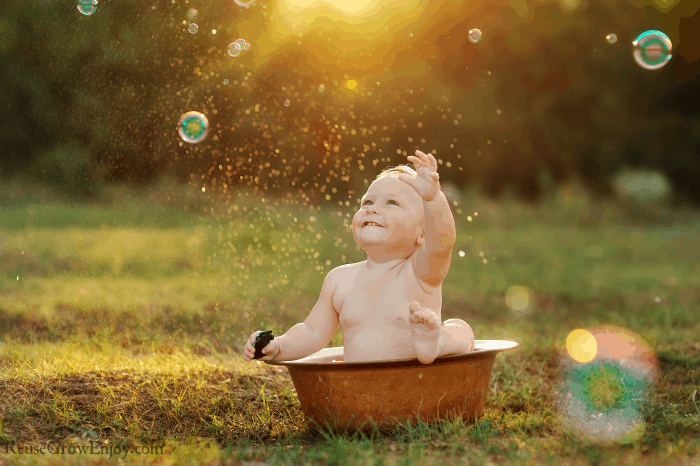 Baby taking bath outdoors