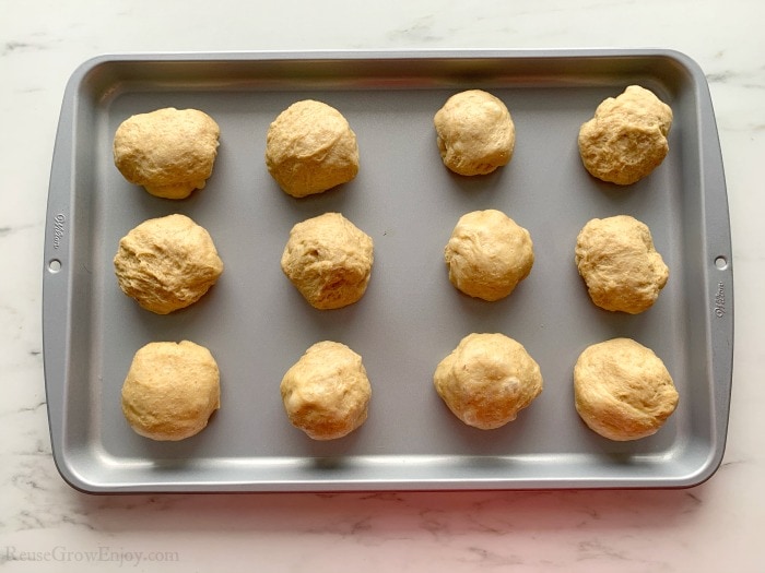Balls of dough on cookie sheet