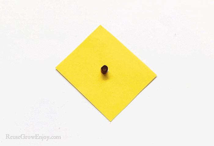 Brown coil on yellow paper