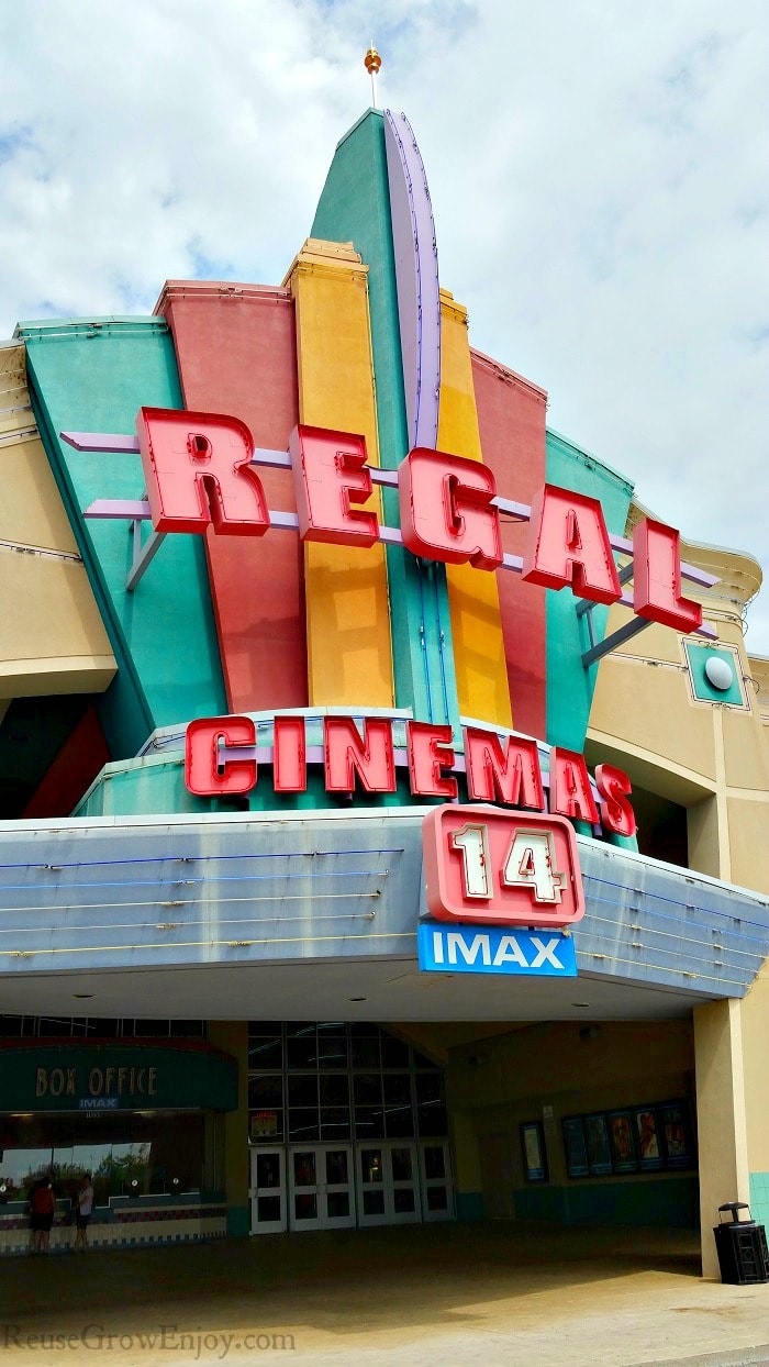 Box office Regal theater with summer movies on the posters.