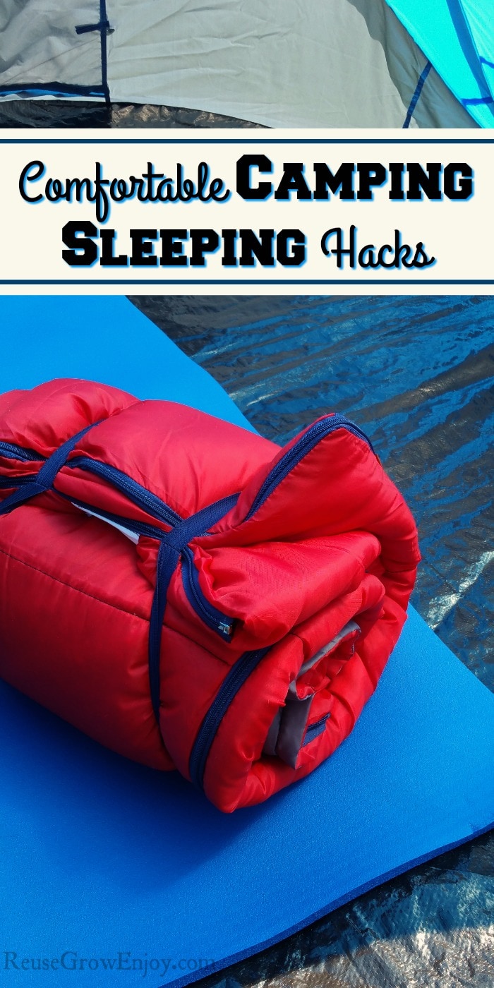 Red sleeping bag rolled up and laying on a blue foam mat inside of a tent. Text overlay says Comfortable Camping Sleeping Hacks.