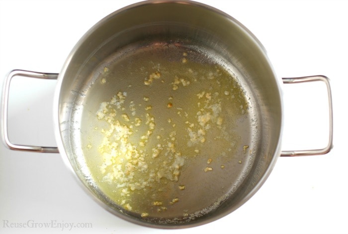 Garlic cooking in butter in soup pot