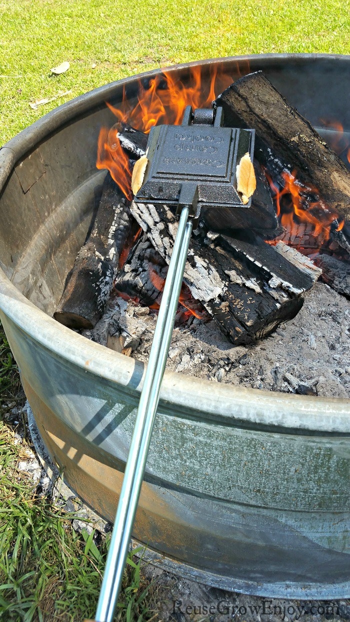 Cooking pie iron over fire