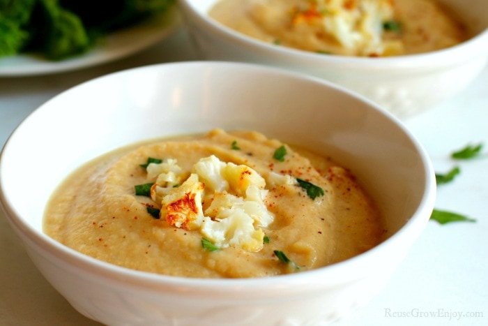 Creamy Roasted Cauliflower Soup in a white bowl