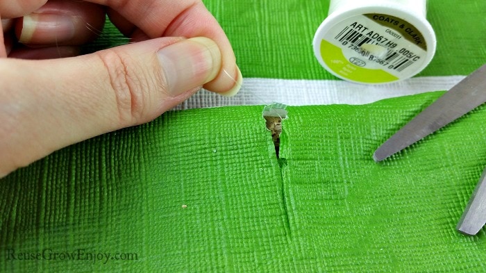 Hole cut in green backing to show the stick slightly the clear thread can be tied on