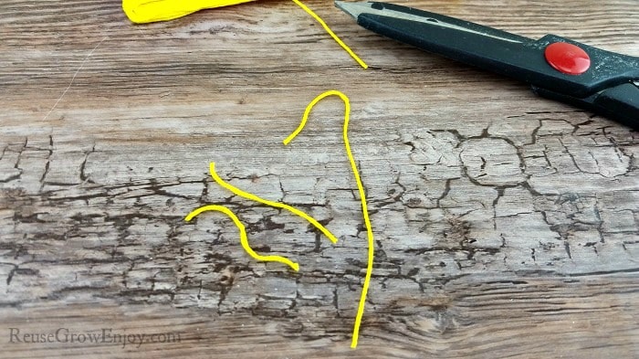 A few pieces of cut yellow thread.