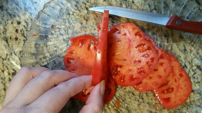 Cutting tomatoes into slices