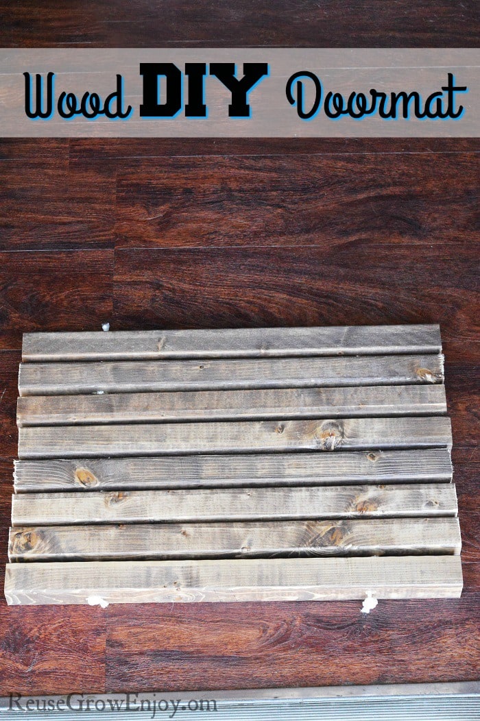 Need a new doormat? This is a nice easy DIY you can do. It is a wood DIY doormat.