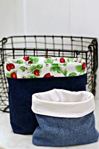 Two upcycled jean pouches and one black wire basket