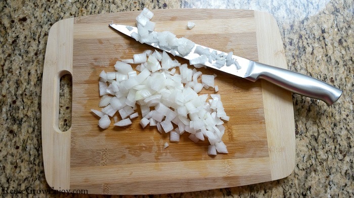 Diced onions on cutting board with knife