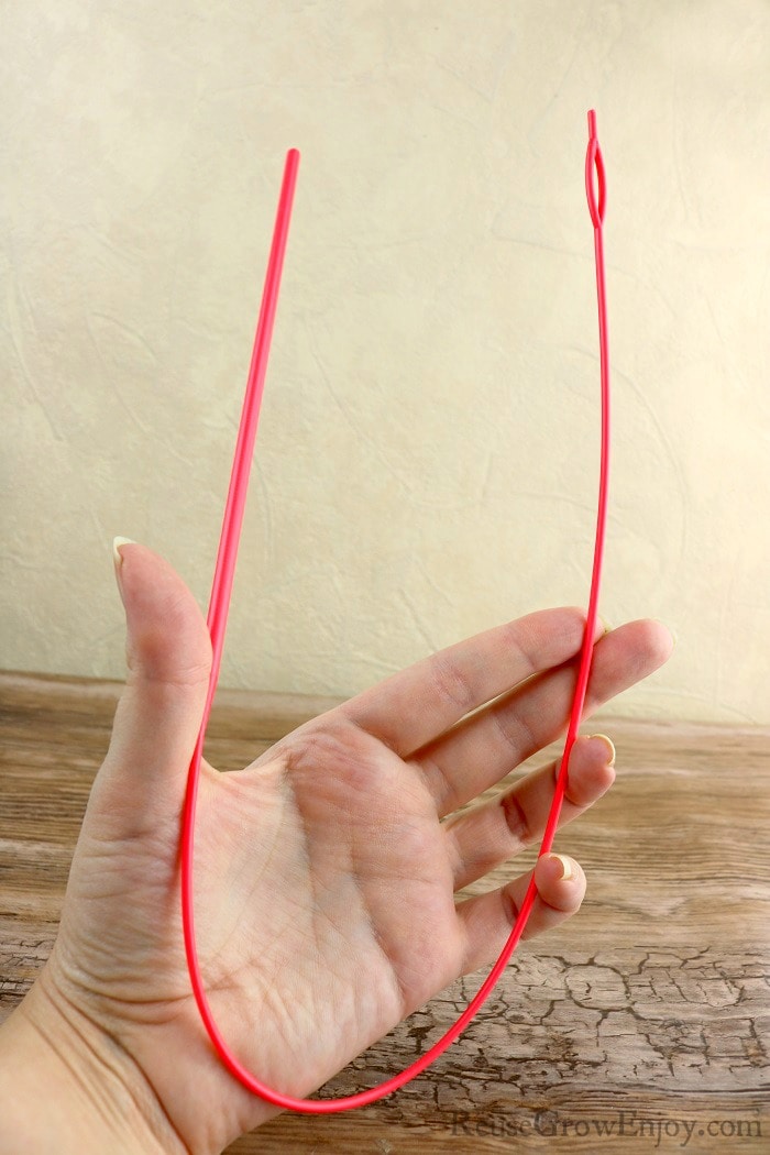 Hand holding an easy drawstring threader