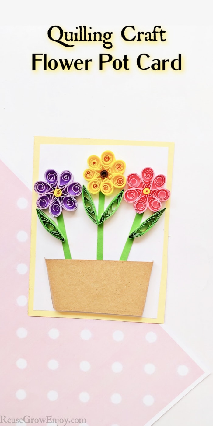 Quilled flowers on paper making a card. Text overlay at top saying Quilling Craft Flower Pot Card