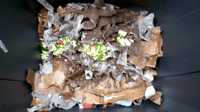 Paper, dirt and scraps added to the bin.