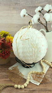 Farm style coffee filter pumpkin with cotton stems in background