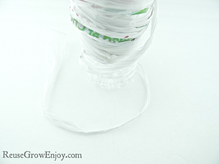plarn wrapped around empty plastic water bottle