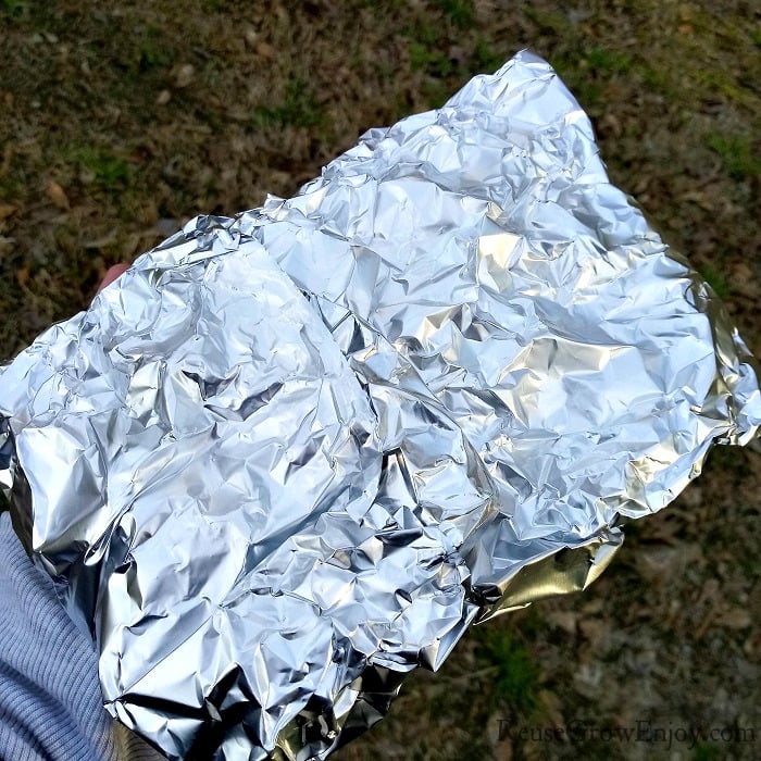 Foil pack after it has been wrapped around the salmon.