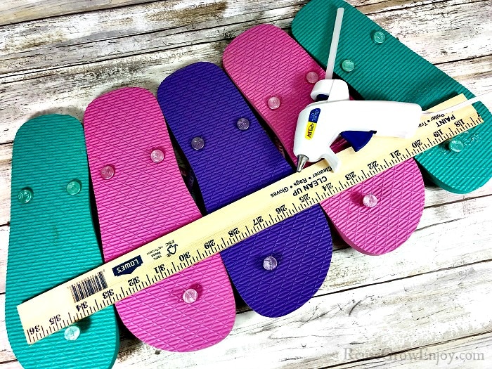 Glue ruler to flip flops