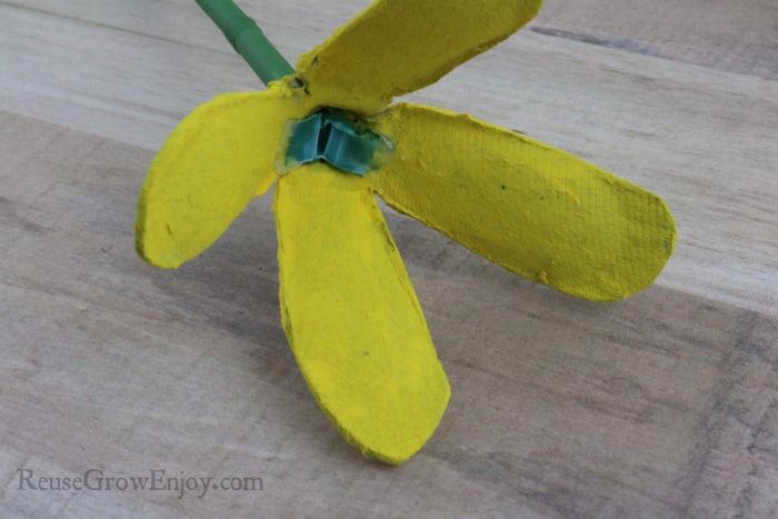 Glue straw to petals