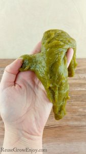 Looking for something fun to do with the kids? I have found a way to make green DIY Slime that is 100% natural! No glue and no borax!