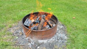Heat pie iron over fire