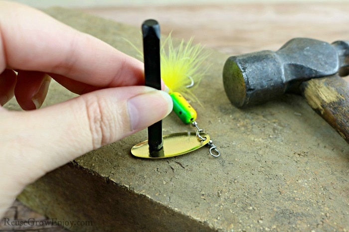 Hand holding Stamp On Lure