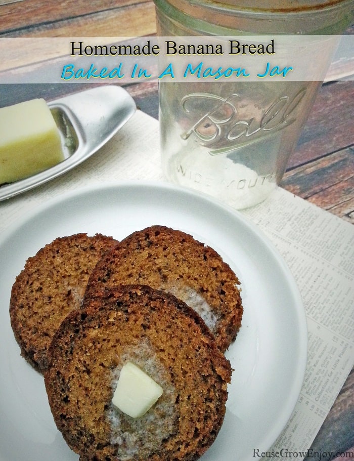 Slices of banana bread on white plate with mason jar and butter in background.