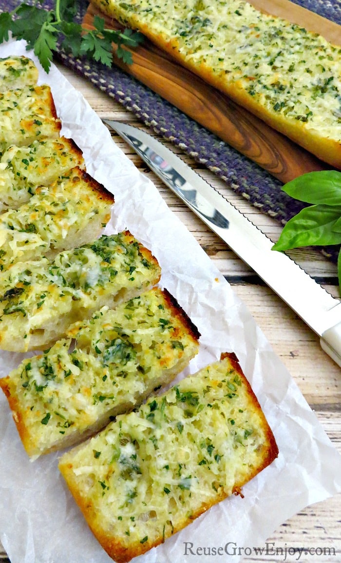 Love fresh garlic bread? Check out this recipe for homemade garlic bread with parmesan herb butter. It is so easy to make and sure to be a family favorite!