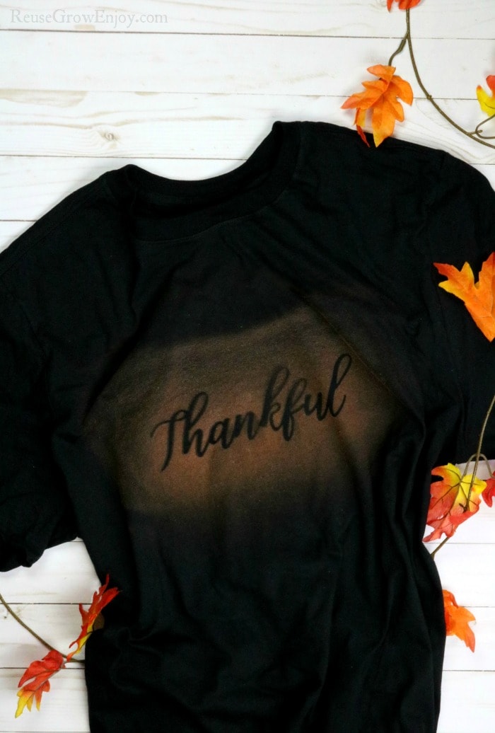 Black t-shirt with bleach print word thankful on it