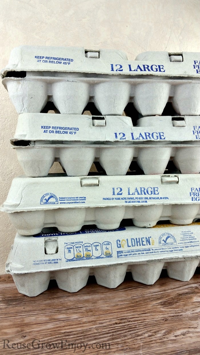 Stack of empty paper egg cartons.