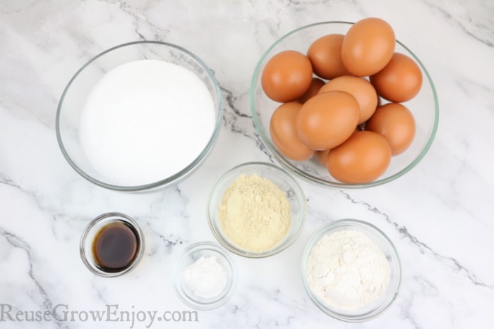 Ingredients needed to make cake, eggs, vanilla, flour, sweetener