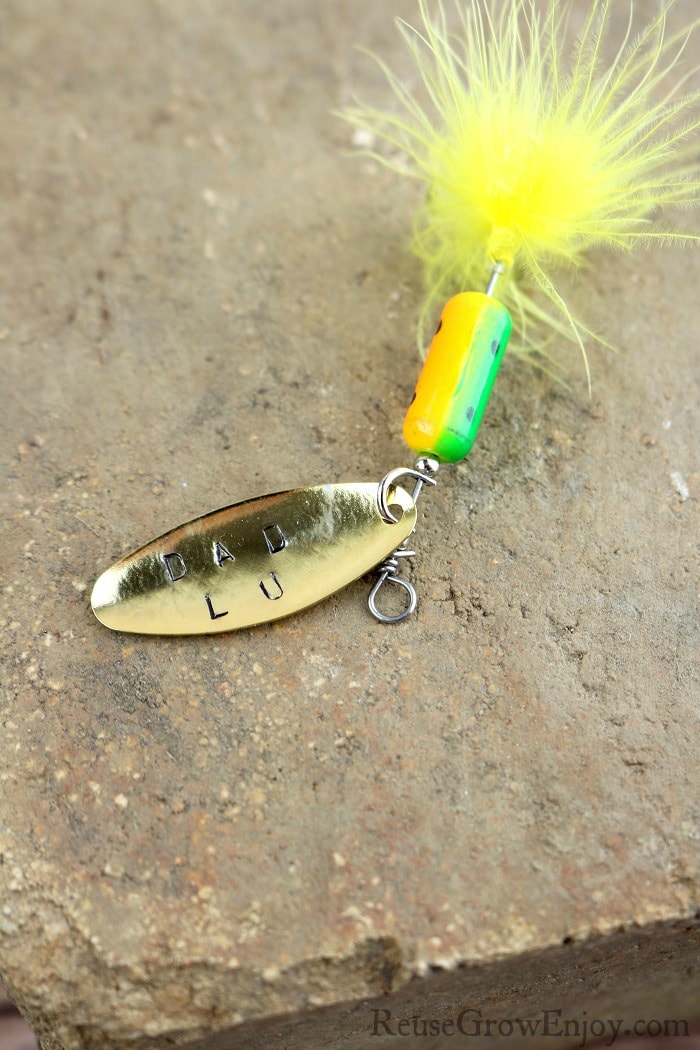 Dad fishing gift lure with hand stamped letters.