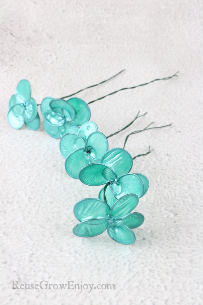 Nail Polish Wire Flowers laying flat on counter