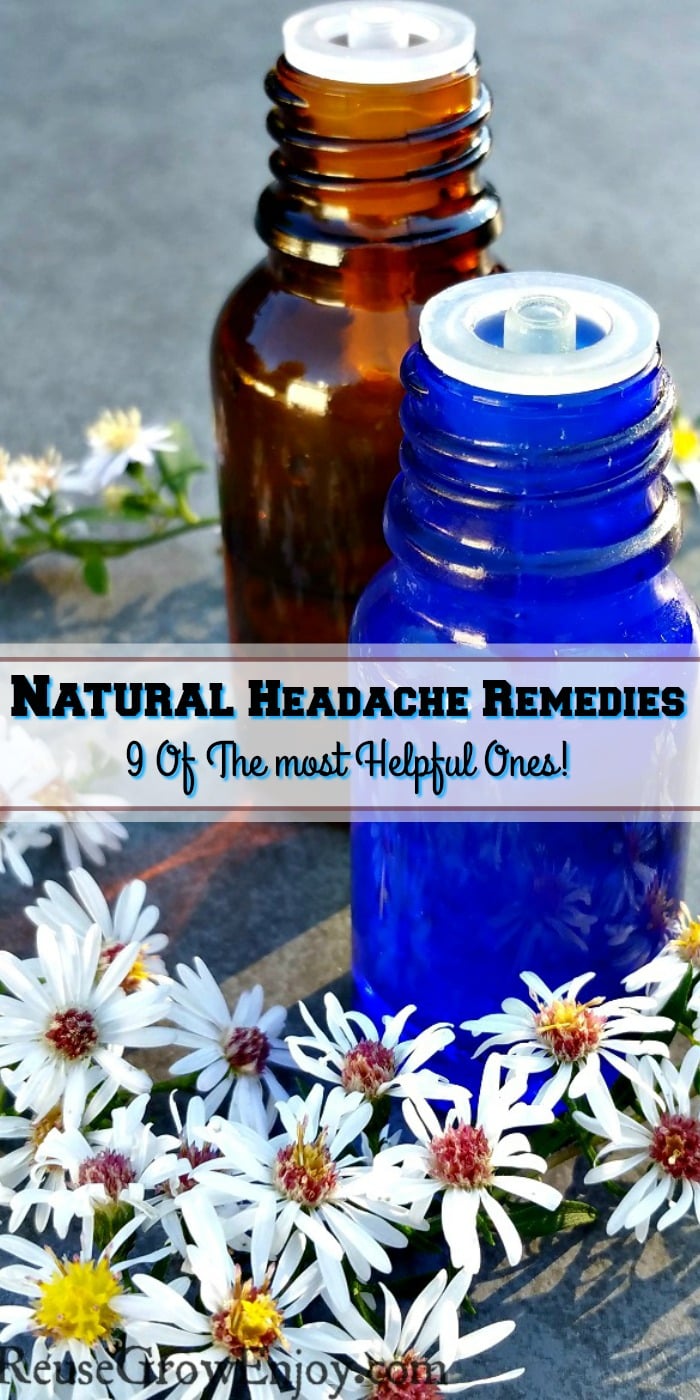 One brown and one blue small essential oil bottle with little white flowers all around them. Text overlay that says Natural Headache Remedies 9 Of The Most Helpful!