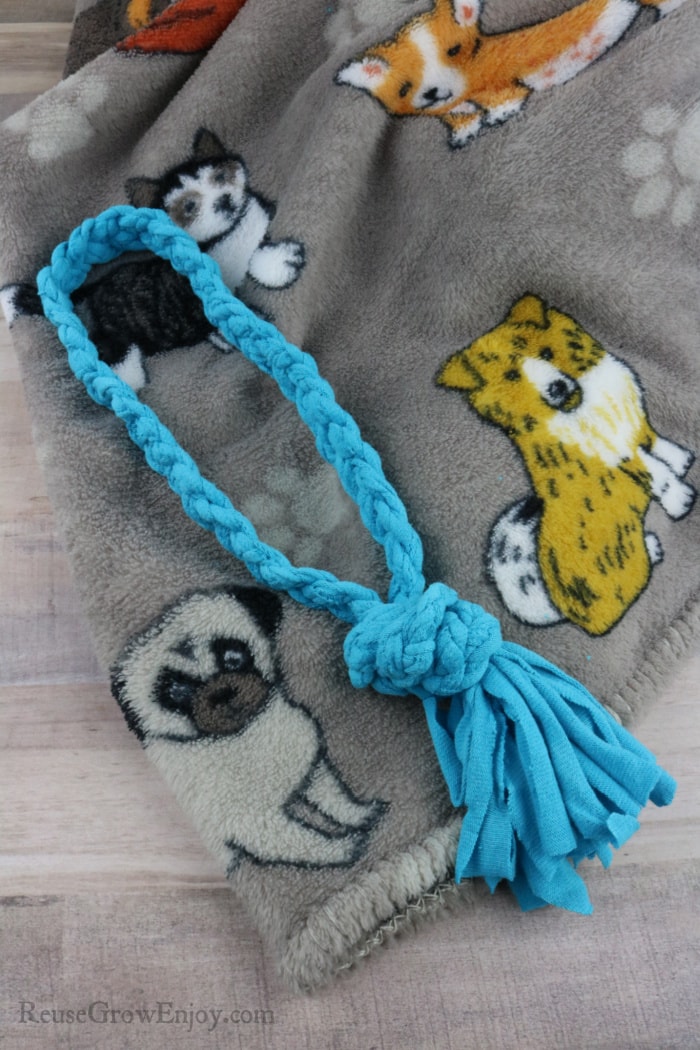 A blue rope dog toy made from old t-shirt