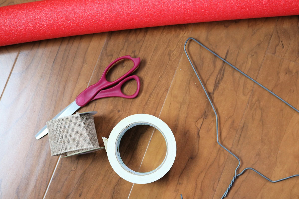 Craft supplies for making a giant candy cane from a pool noodle.