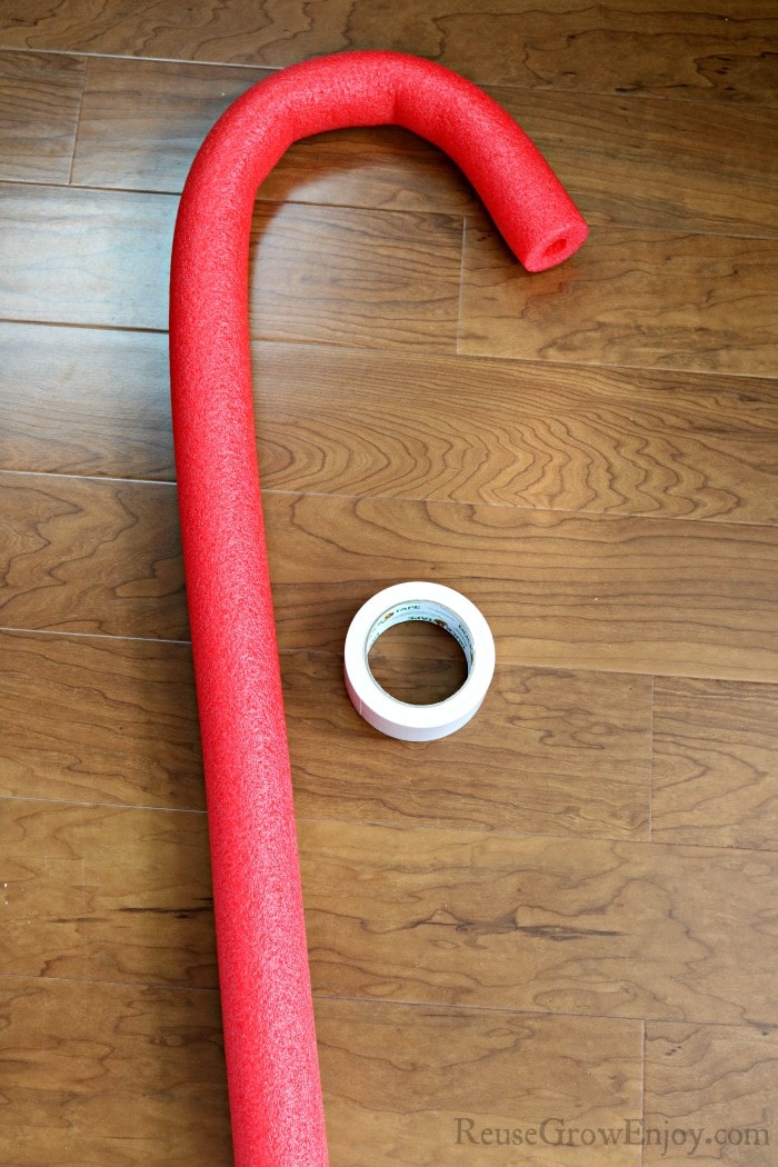 Red pool noodle shaped like a cane