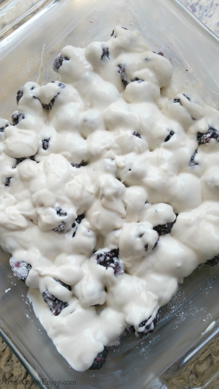 Pour batter over berries