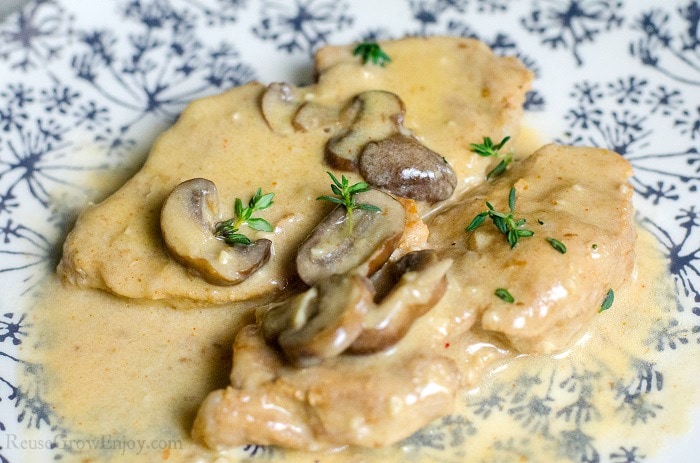 Pressure Cooker Pork Chops on a plate With Mushroom Gravy