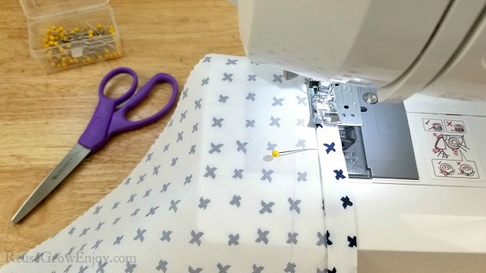 Sewing fabric along pins with sewing machine