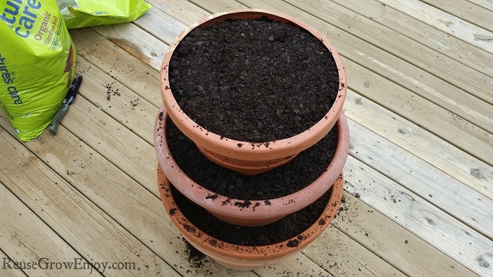 All three layers of pots filled with soil