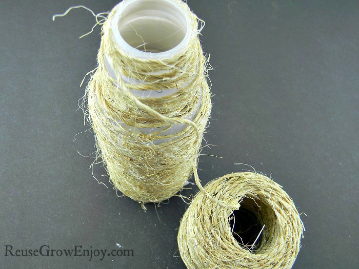 Twine wrapped all the way from one end of the plastic bottle to the other end