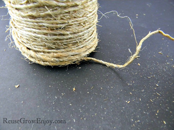 Bottom of the bottle with twine hanging off