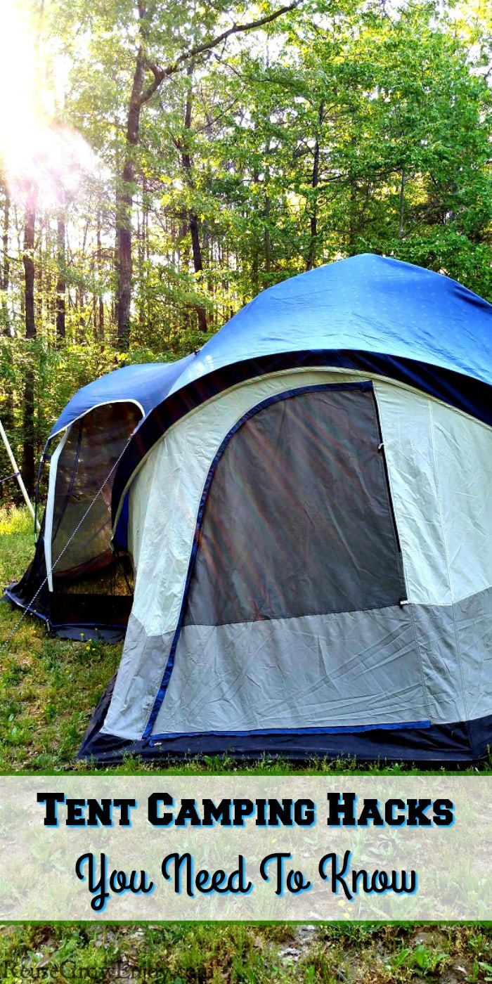 Large family tent with the sun shining through the trees on to the tent. Text overlay at the bottom that says Tent Camping Hacks You Need To Know.