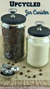 Two glass jars that have been turned into upcycled jar canister with stainless steel knobs on top. One jar is filled with coffee beans and the other with raw sugar.