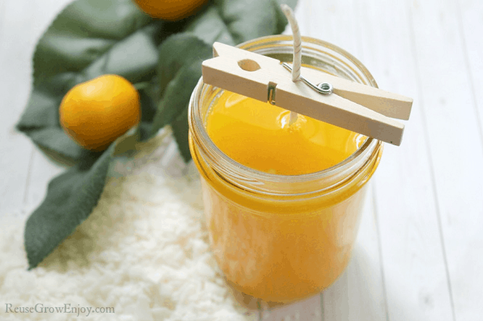 Hot wax poured over wick in jar.