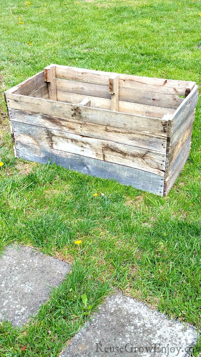 Need some extra growing space this garden season? If you have a pallet, here is a project you can do. I am going to show you step by step how to make this Wood Pallet DIY Raised Planter Box!